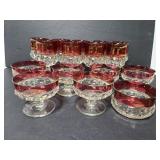 Red and clear glass goblets, dessert cups and bowl