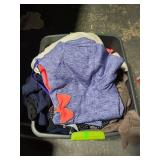 Bin of medium and large clothing