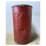 Old rusty red metal barrel