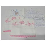Five vintage embroidered pillow cases