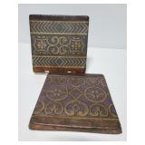 Two World Market clay tile wall art