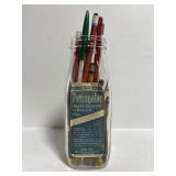 Vintage glass pint bottle of pencils