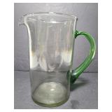 Glass pitcher with green glass handle