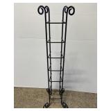 Tall black scrolling metal CD tower