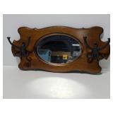 Wall mirror with cast iron hooks