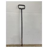 Old rusty metal fire poker tool