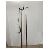 Pair of antique primitive fishing tools on poles