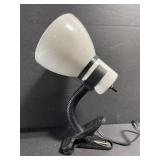 Small clamp on metal desk lamp