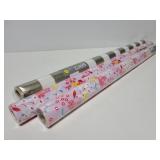 Three rolls of Spritz gift wrap