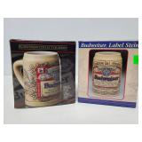 Two Budweiser steins in boxes