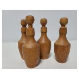 Four wood bottle shaped pieces