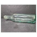 Rounded bottom glass bottle