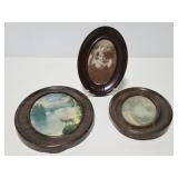 Three oval framed prints