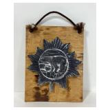 Mounted soap stone bear on wood