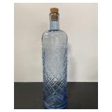 Tall blue cut glass bottle w/ cork