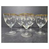 Five gold rim wine glasses