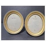 Two vintage small oval frames