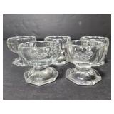 Five glass salt cellars