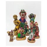 Eight creepy wax clowns
