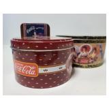 Three Coca-Cola tins