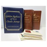 Three golden replica stamp books & loose covers