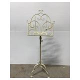 Cream colored scrolling metal music stand