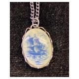 Pair of silver toned chains & pirate ship pendant