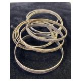 Lot of silver & good toned bangle bracelets