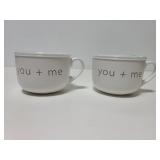 Two white soup traveller mugs