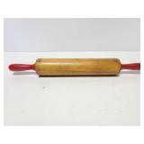 Vintage red handle rolling pin
