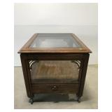 Rolling glass top end table