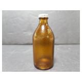 Tiny brown glass bottle
