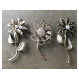 Trio of flower brooches