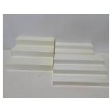 Three plastic step display shelves