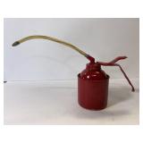 Vintage red metal oil can