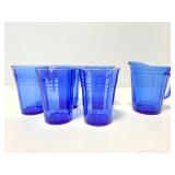 Blue glass creamer and 5 cups