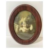 Antique 1897 Cupid awake in oval frame