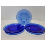 Five blue glass plates