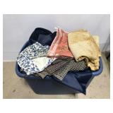 Tub of assorted fabric pieces
