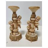 Mold cherub candlestick pair