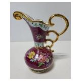 Ornate porcelain pitcher