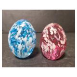 Pair of art glass egg paperweights
