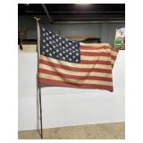 Vintage American flag on eagle emblem metal pole