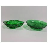Two emerald green glass dishes
