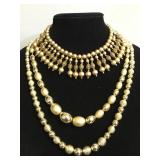 Three gold tone bead necklaces