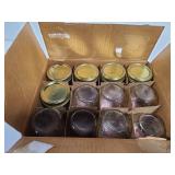 Twelve vintage mason jars in kerr box
