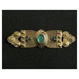 Art Deco style green gem brooch