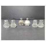 Three sets of tiny glass shakers