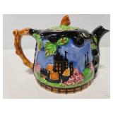 Vintage ceramic teapot with raised design