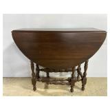 Vintage gate leg dark wood drop leaf table
